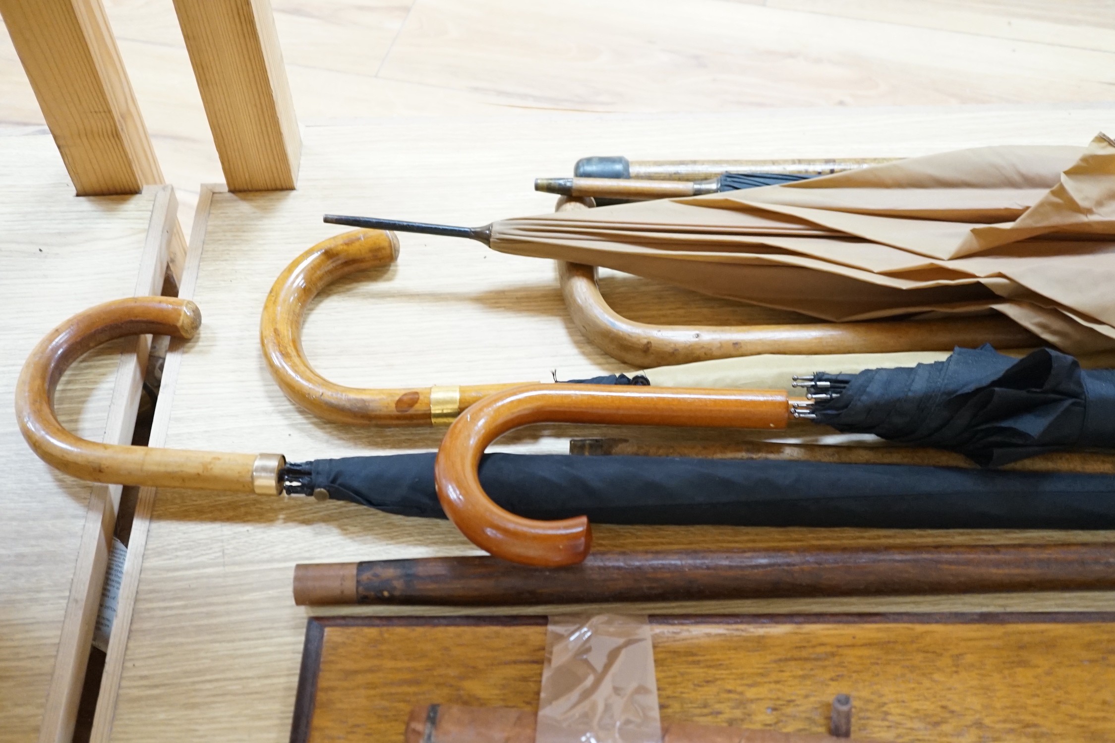 Four umbrellas and four walking sticks